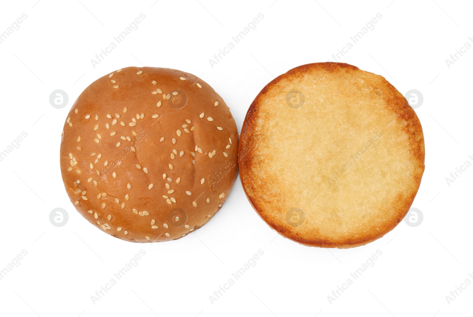 Photo of Halves of grilled burger bun isolated on white, top view