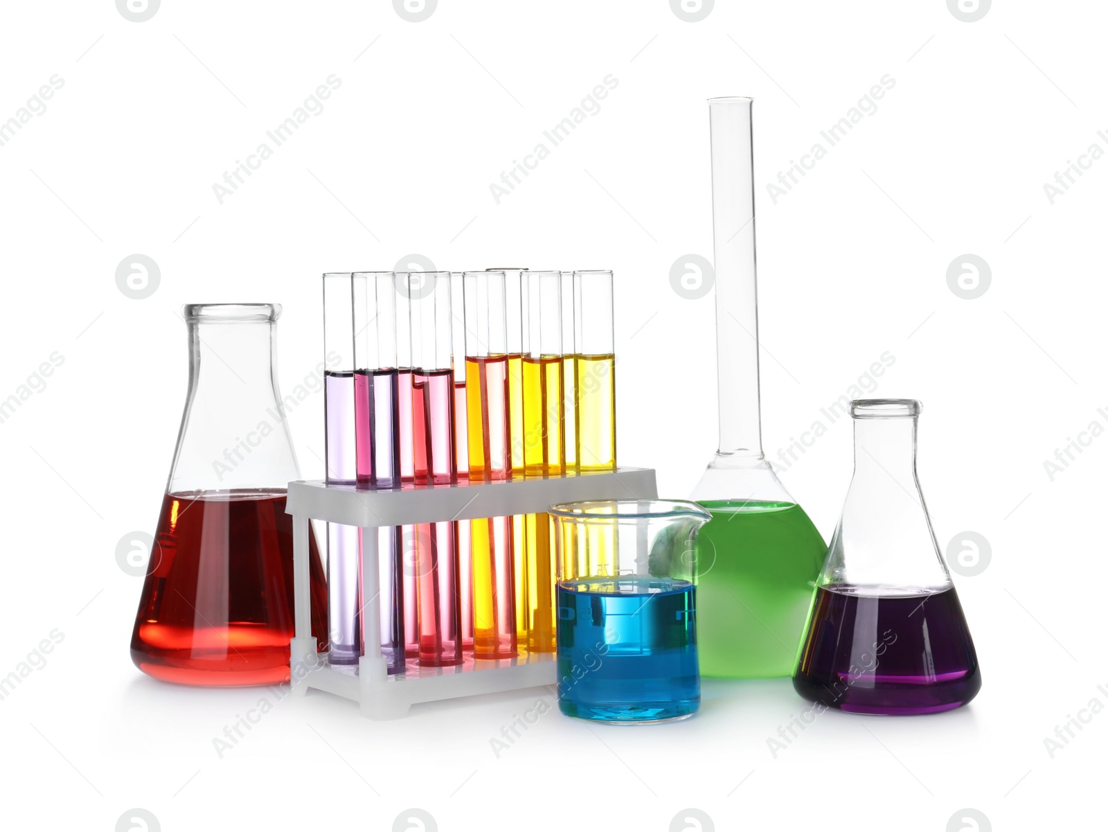 Photo of Laboratory glassware with color liquids on white background