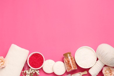 Photo of Sea salt and different spa products on pink background, flat lay. Space for text