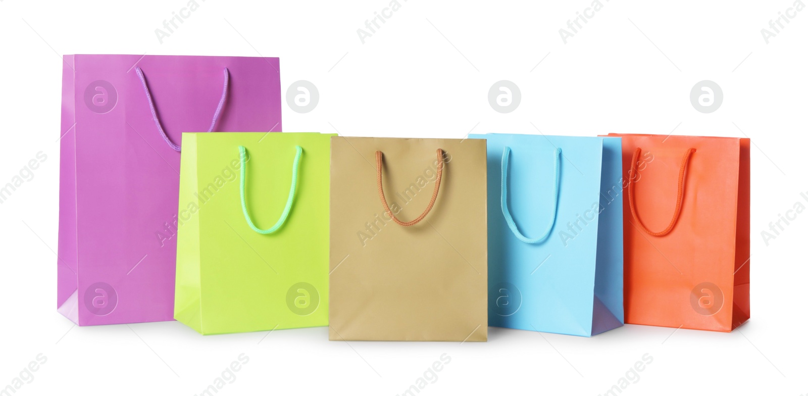 Photo of Colorful paper shopping bags isolated on white