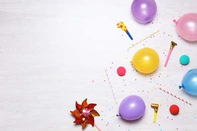 Photo of Flat lay composition with colorful balloons and space for text on light background