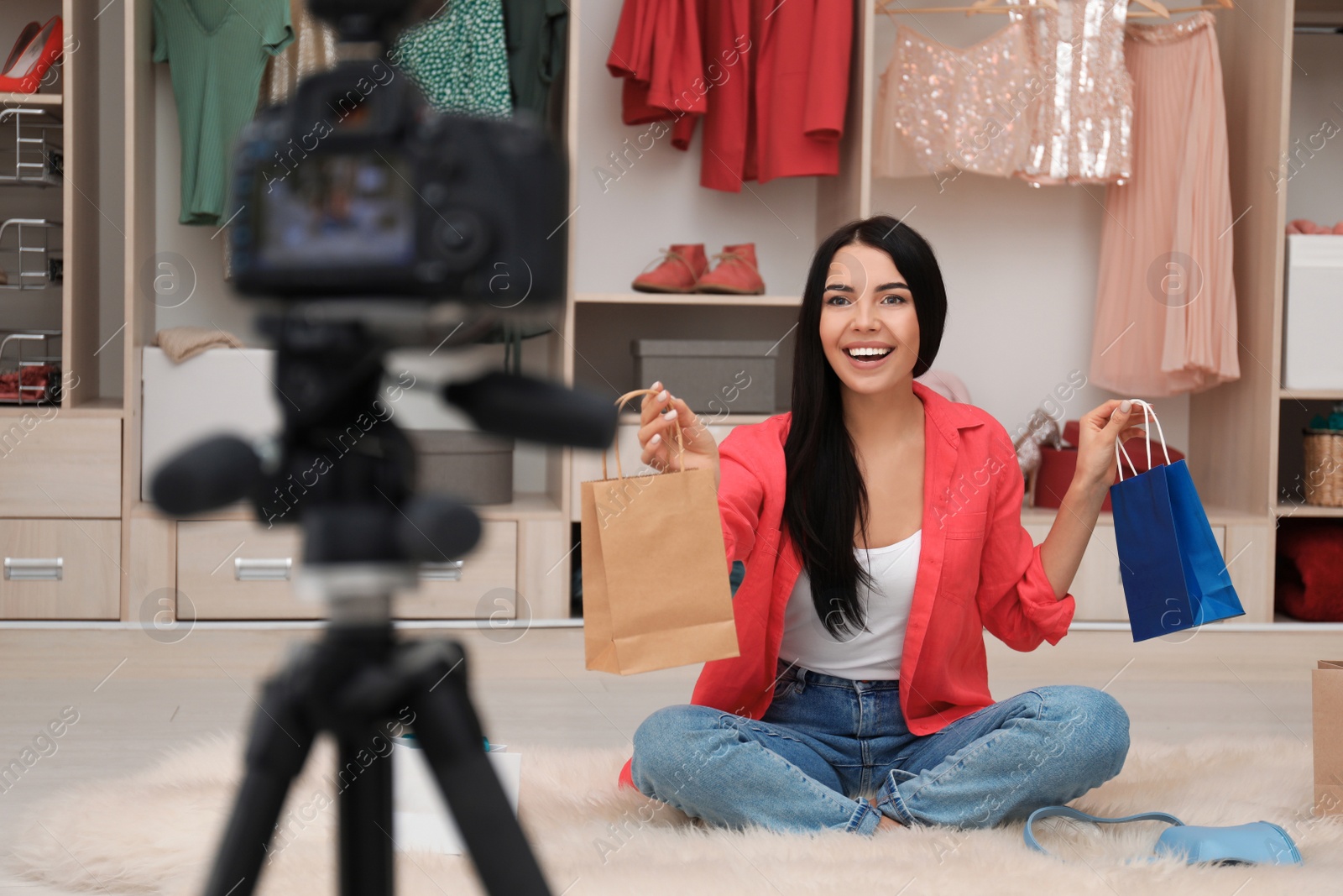 Photo of Fashion blogger recording new video in room