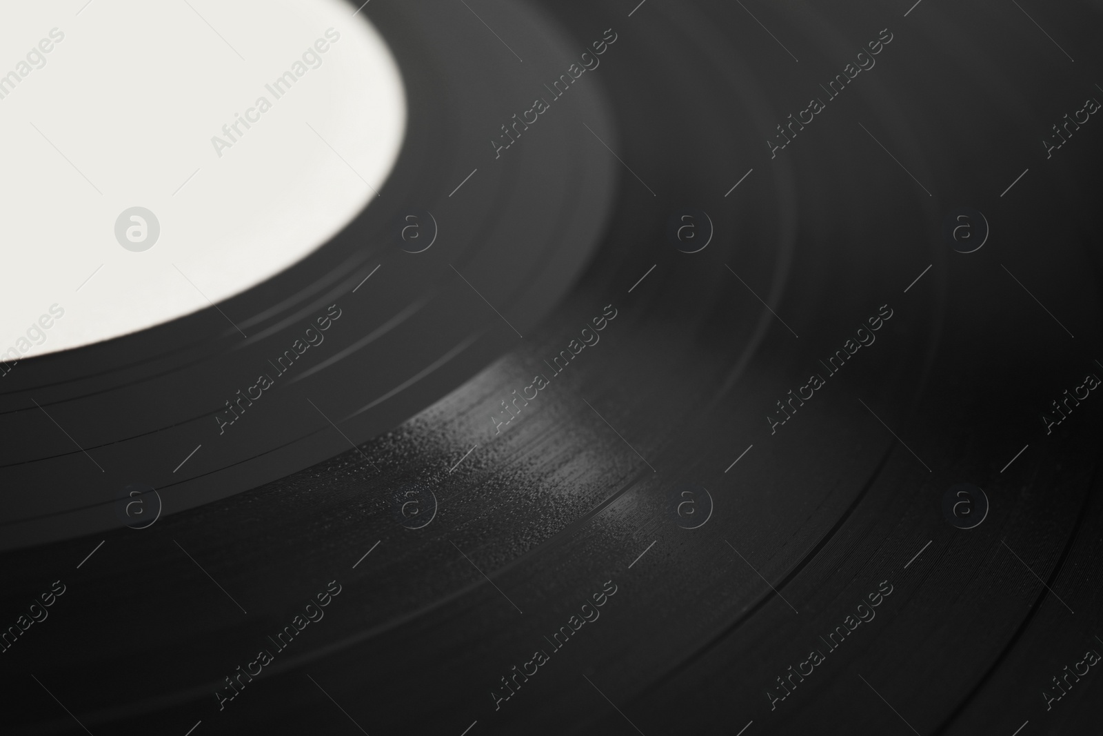 Photo of Closeup view of vintage vinyl record as background