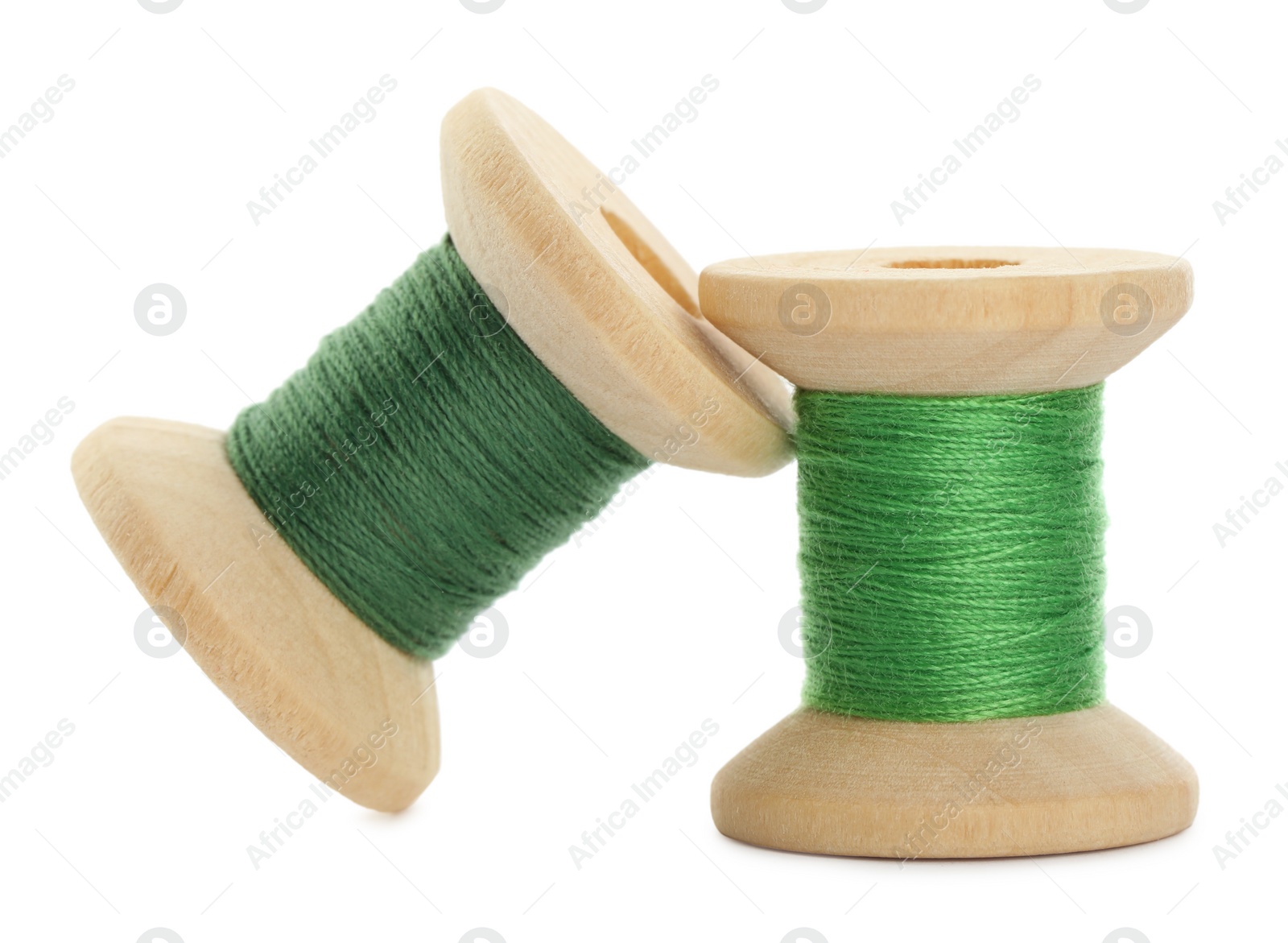 Photo of Different colorful sewing threads on white background, closeup