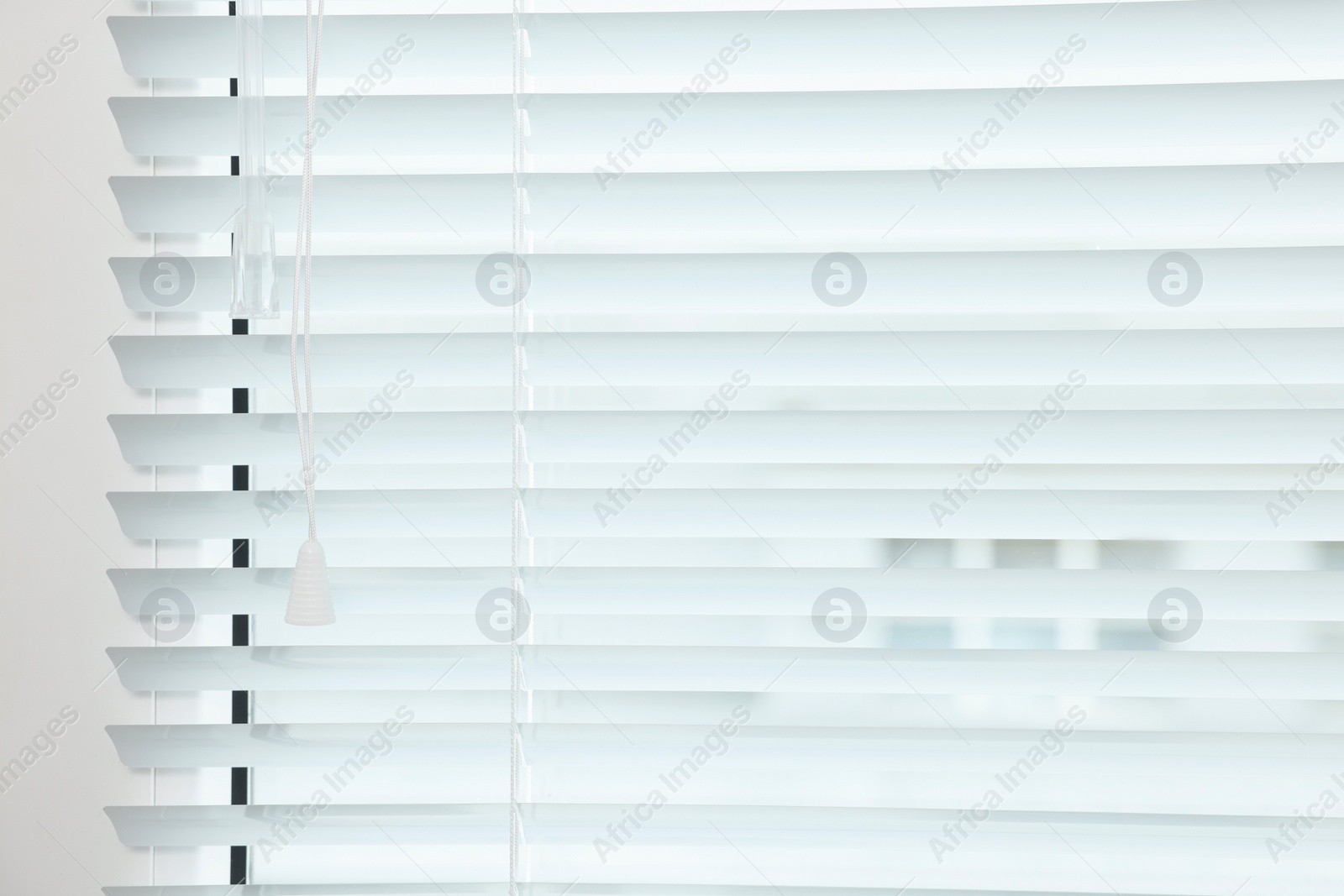 Photo of Closeup view of stylish horizontal window blinds