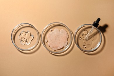 Flat lay composition with Petri dishes on beige background