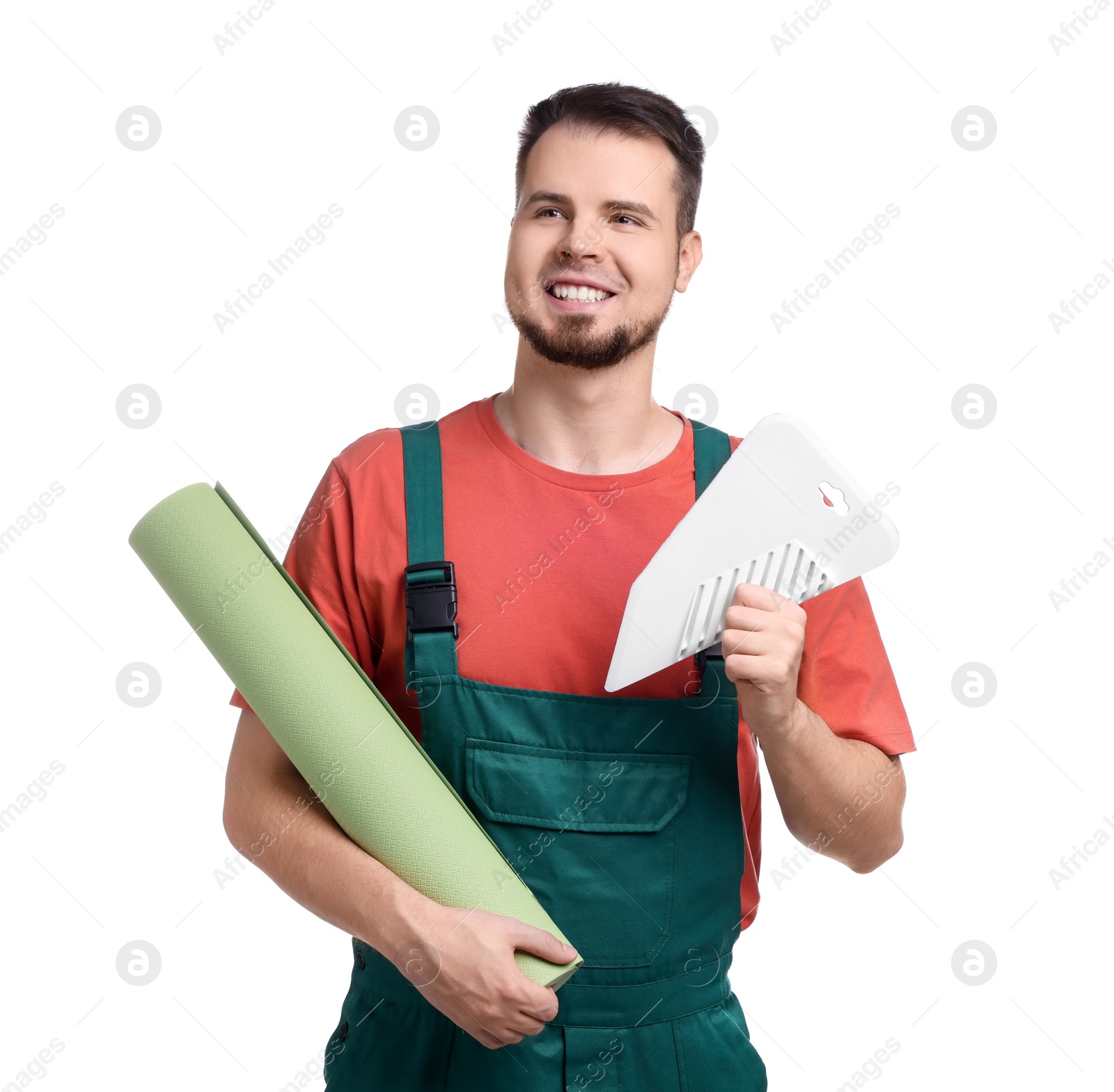 Photo of Man with wallpaper roll and spatula on white background