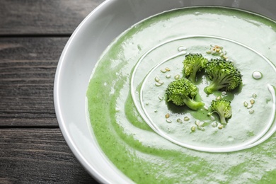 Fresh vegetable detox soup made of broccoli in dish on table, closeup