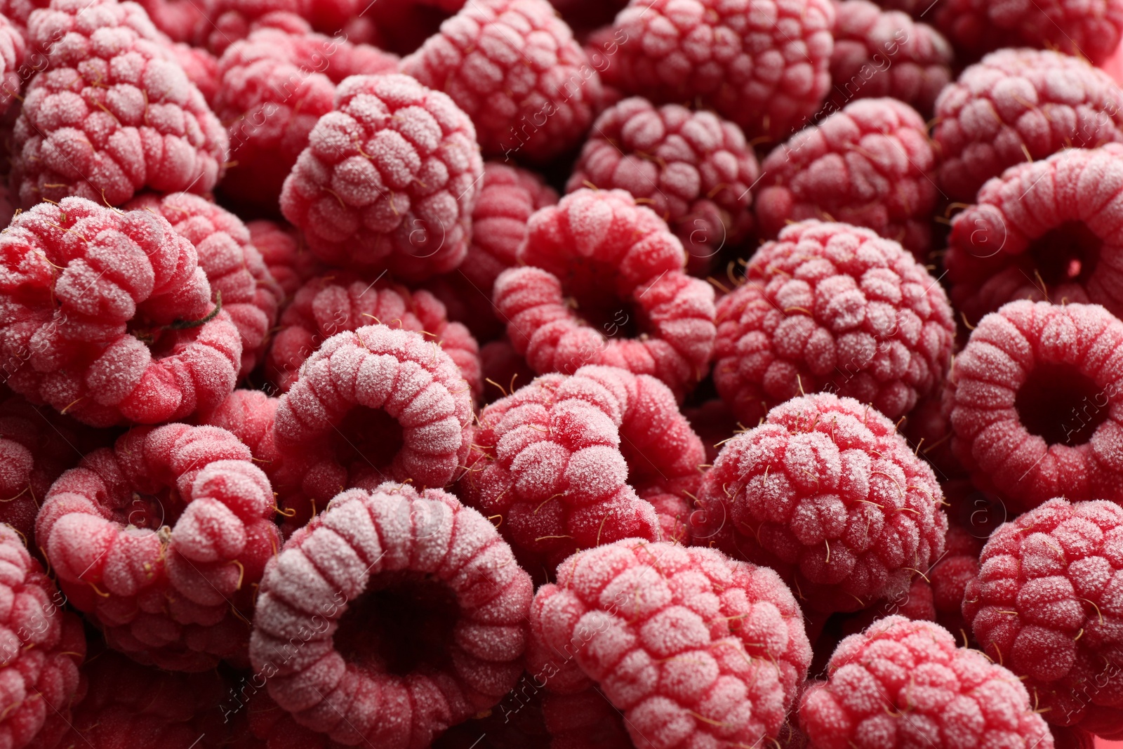 Photo of Tasty frozen raspberries as background, closeup view