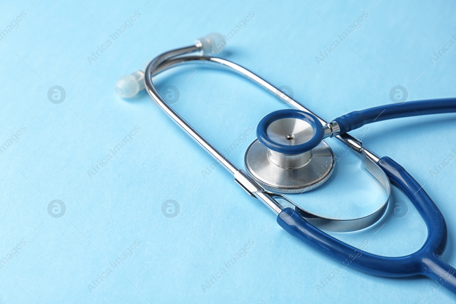 Photo of Stethoscope on color background, closeup. Medical equipment