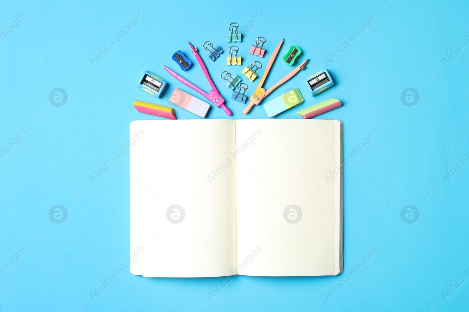 Photo of Different stationery on light blue background, flat lay. Back to school