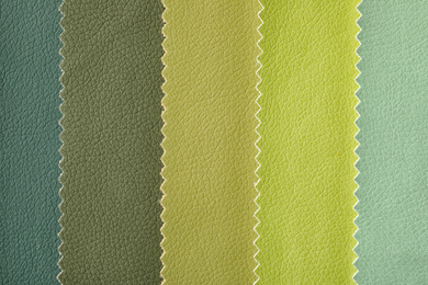 Leather samples of different colors for design as background, closeup
