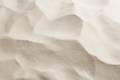 Photo of Dry beach sand as background, closeup view