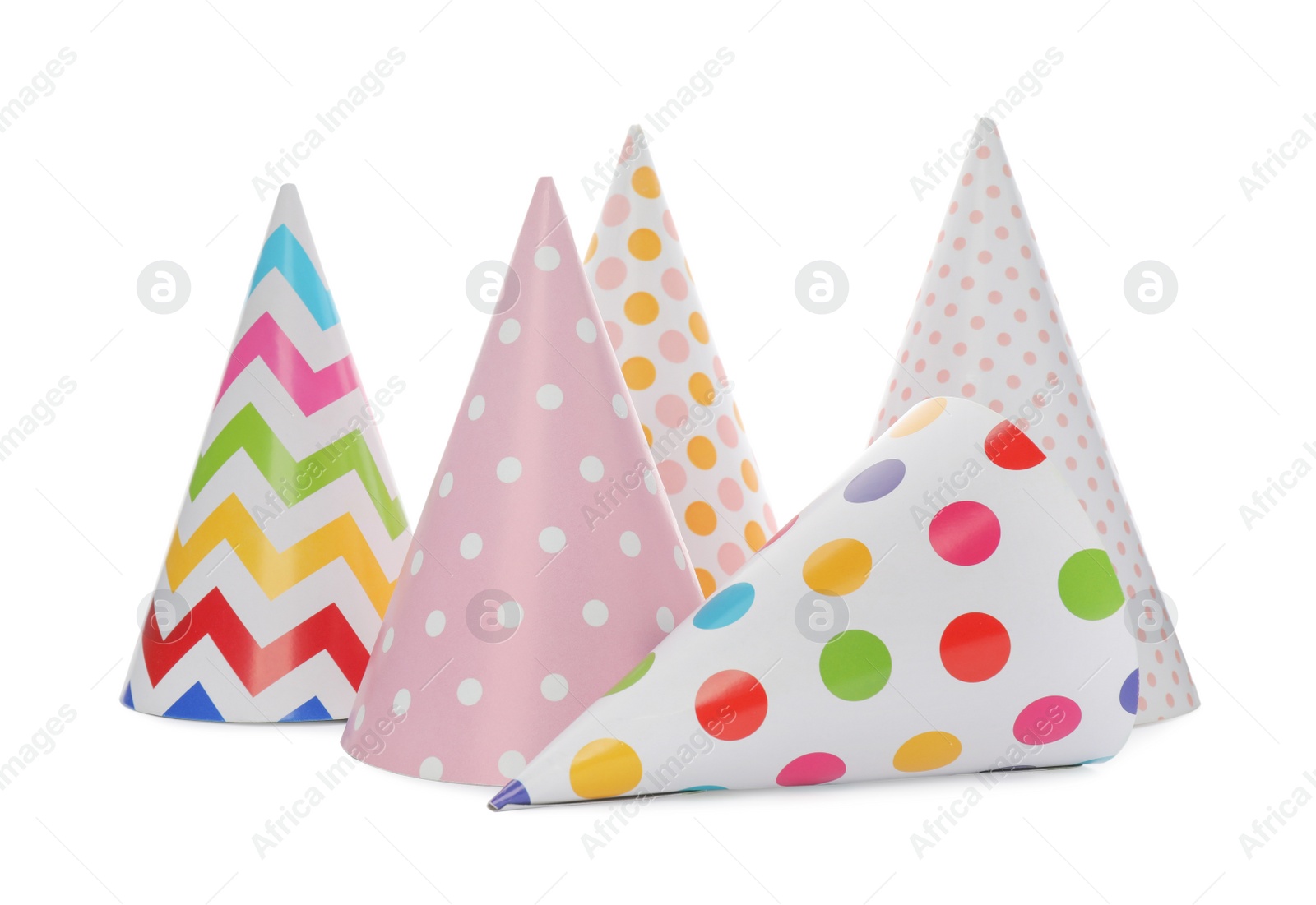 Photo of Bright party hats on white background. Festive accessory