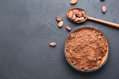 Photo of Flat lay composition with cocoa powder and beans on grey background