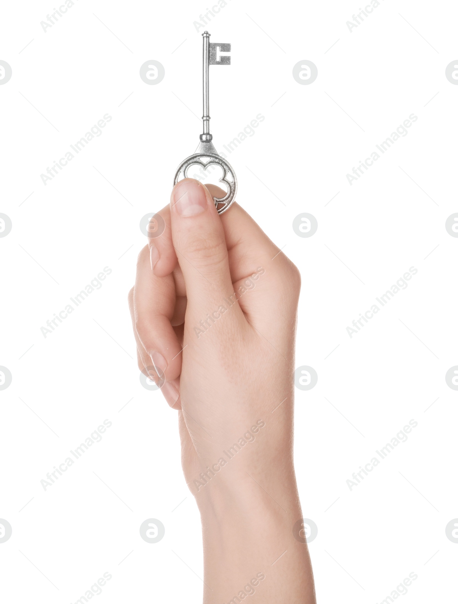 Photo of Woman holding silver vintage ornate key on white background, closeup