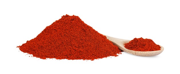 Photo of Wooden spoon and aromatic paprika powder isolated on white
