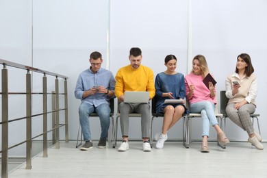 People waiting for job interview in office hall