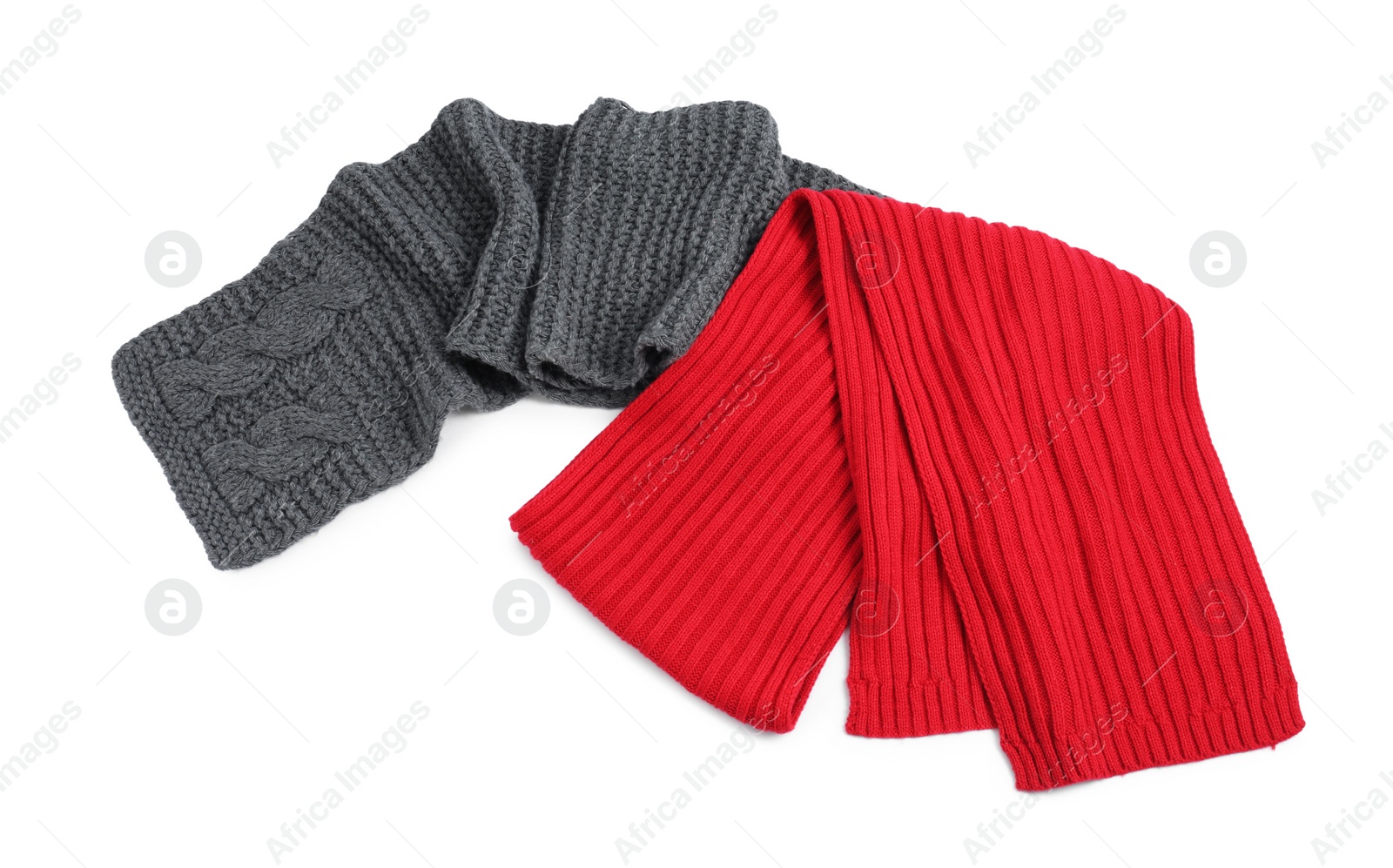 Photo of Two soft knitted scarfs on white background