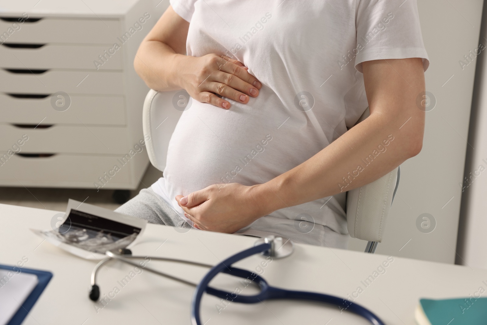 Photo of Pregnant woman in hospital, closeup view. Expecting baby