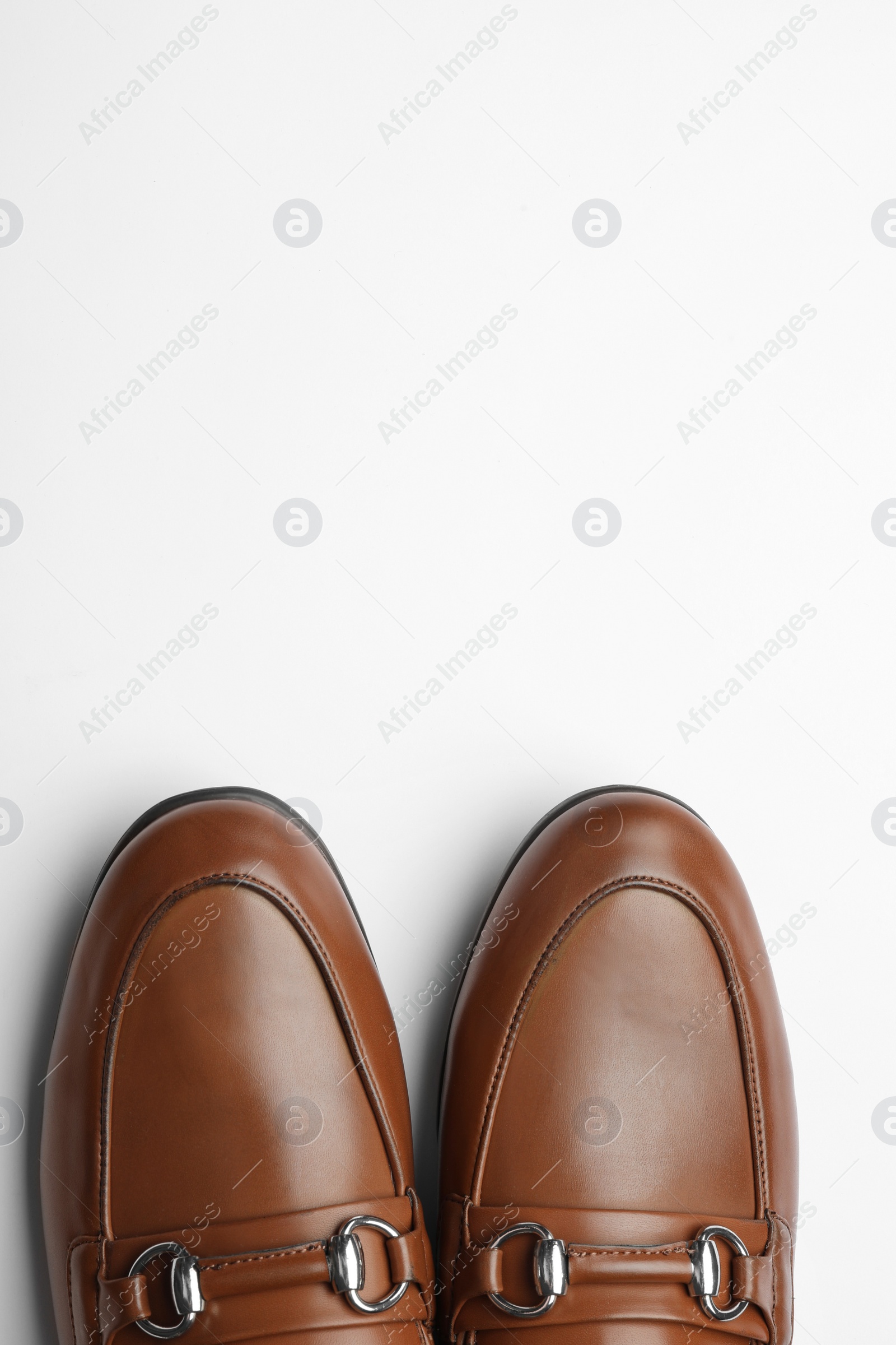 Photo of Pair of stylish male shoes isolated on white, top view