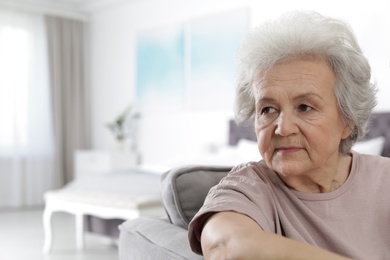 Photo of Portrait of mature woman in living room