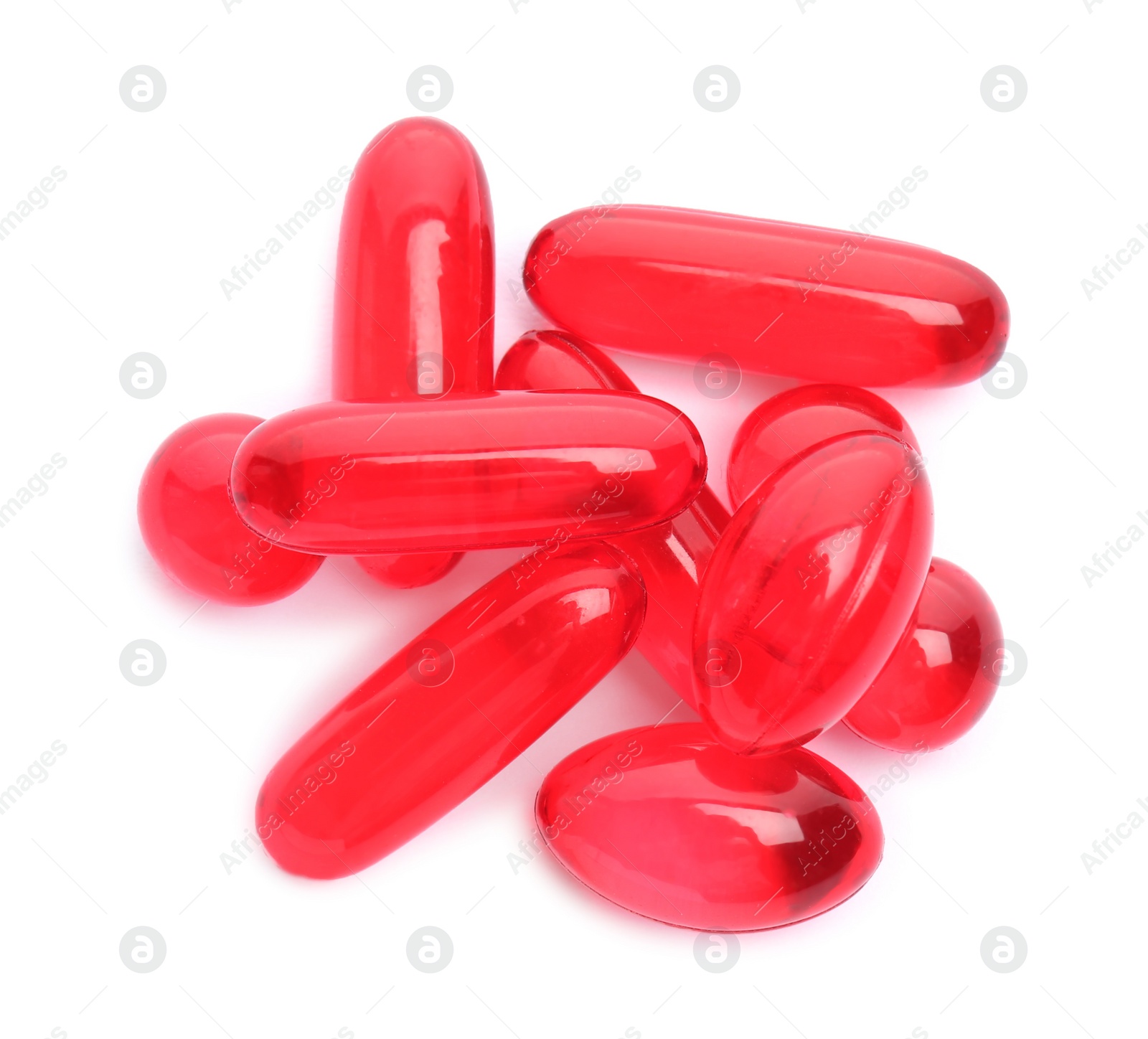 Photo of Color pills on white background, top view. Medical treatment