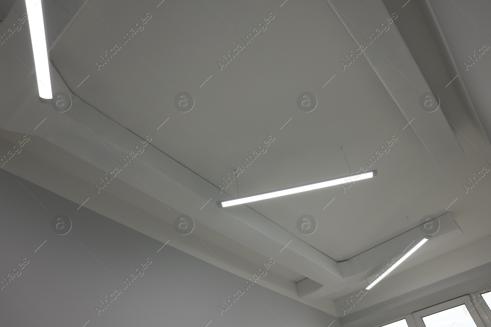 Photo of Ceiling with modern lights in renovated room