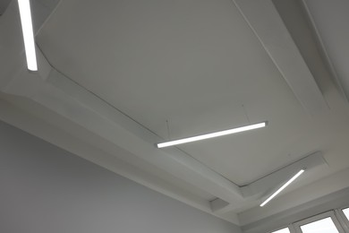 Ceiling with modern lights in renovated room