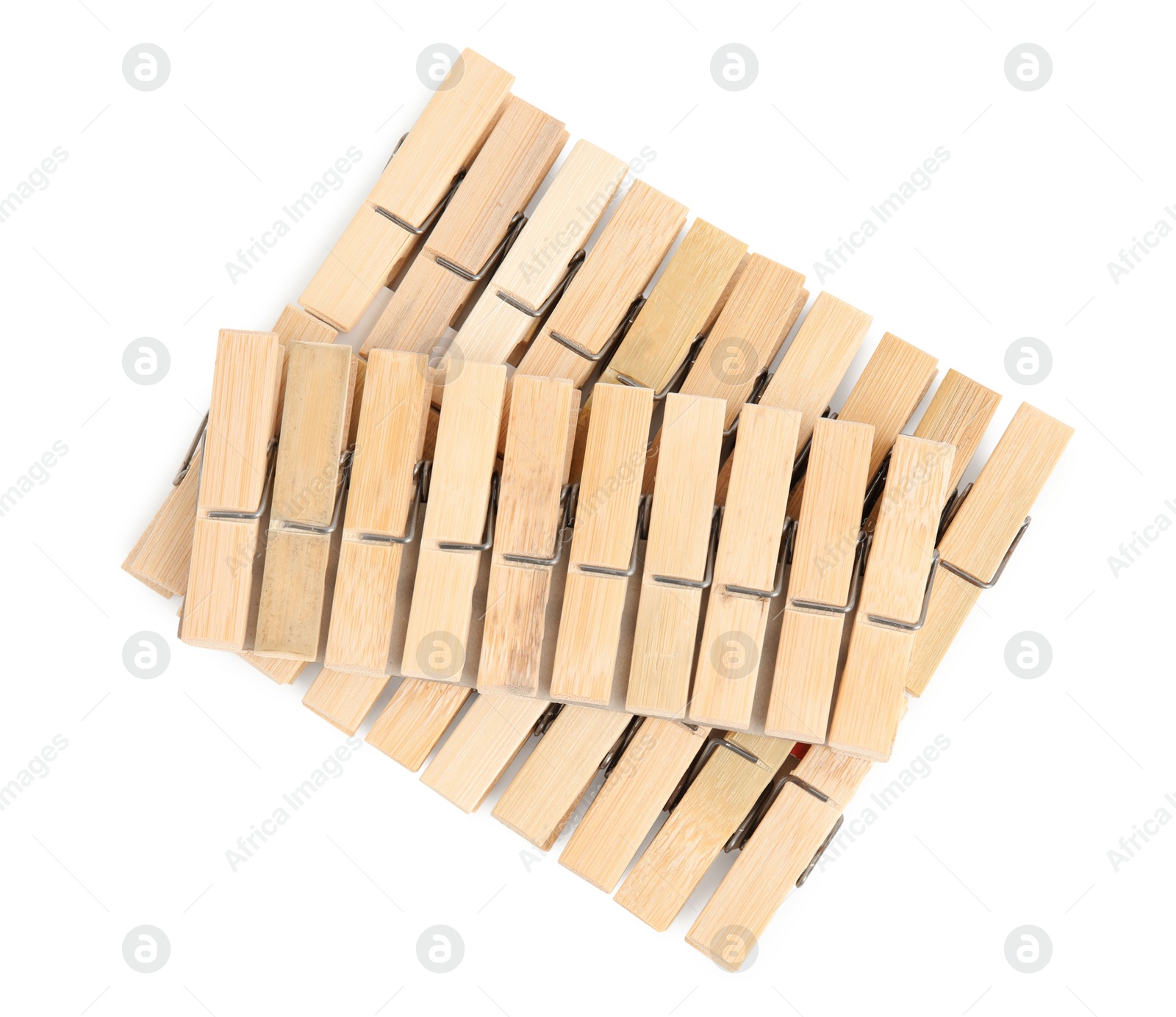 Photo of Set of wooden clothespins on white background, top view