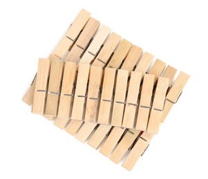 Photo of Set of wooden clothespins on white background, top view