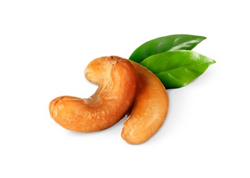 Tasty cashew nuts and fresh green leaves on white background 