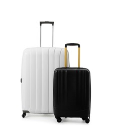 Modern suitcases for travelling on white background