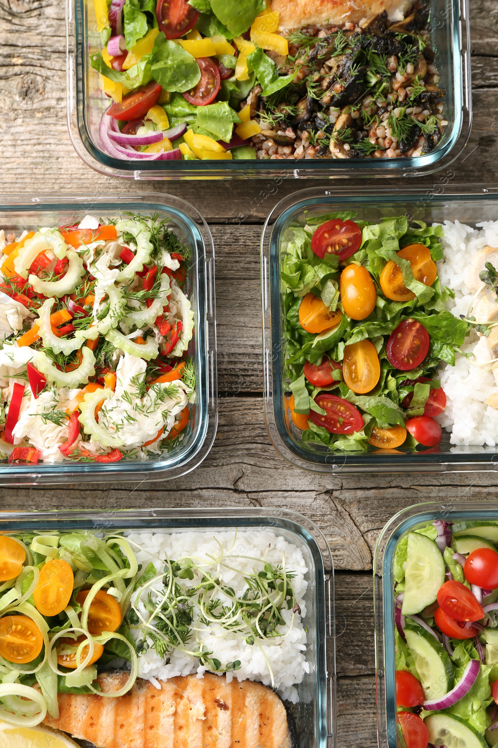 Photo of Healthy meal. Containers with different products on wooden table, flat lay