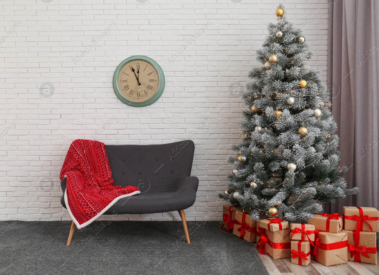 Photo of Stylish Christmas interior with decorated fir tree and comfortable sofa