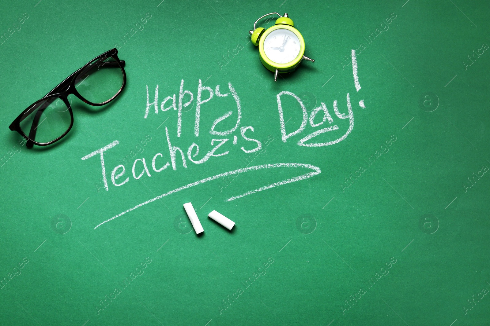 Photo of Flat lay composition with words HAPPY TEACHER'S DAY on chalkboard