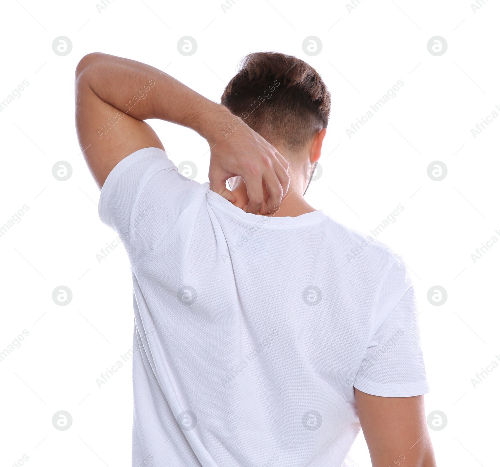 Photo of Young man scratching back on white background. Annoying itch