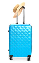 Photo of Blue suitcase with hat on white background