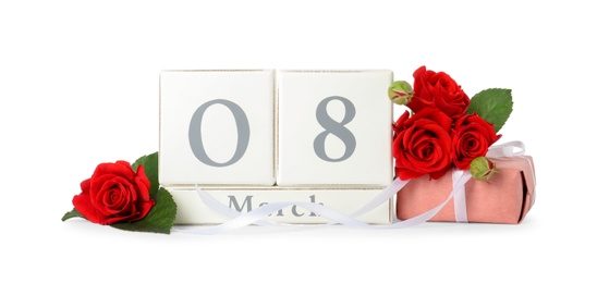 Photo of Wooden block calendar with date 8th of March, gift and roses on white background. International Women's Day