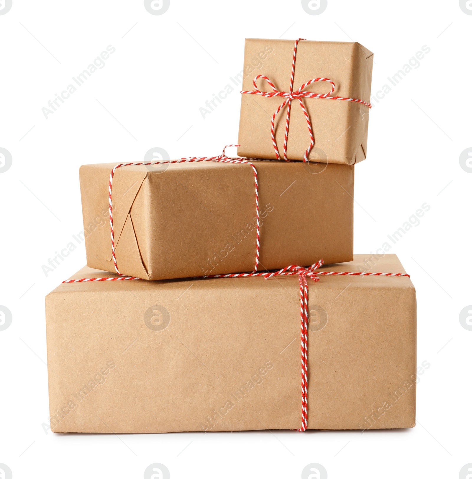 Photo of Gift boxes wrapped in kraft paper with bows on white background