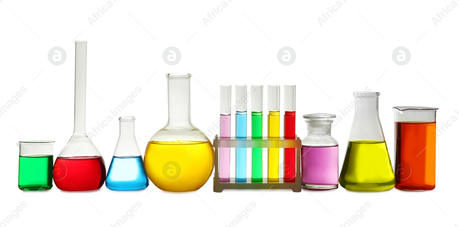 Photo of Laboratory glassware with colorful liquids on white background