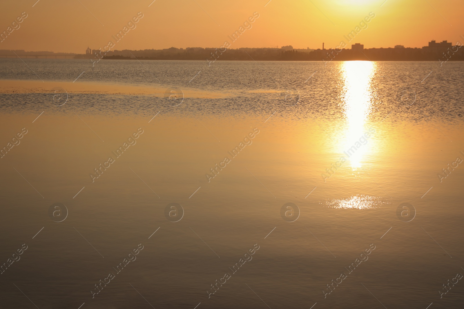 Photo of Picturesque view of beautiful sunrise on riverside. Morning sky