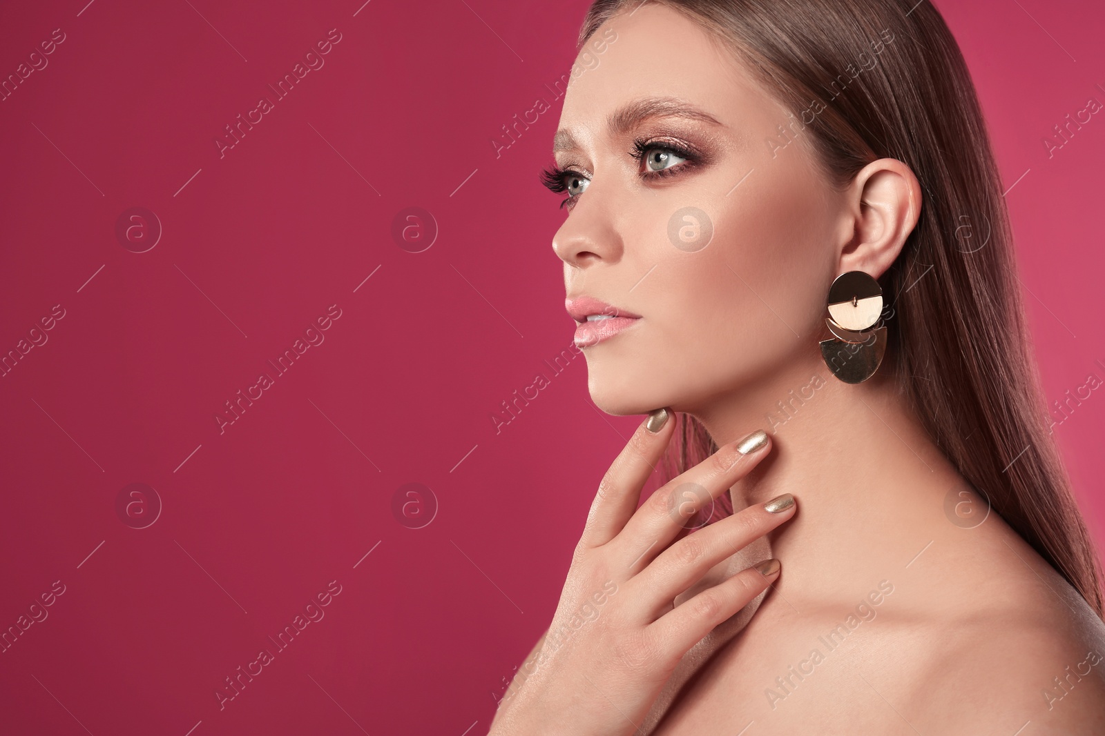 Photo of Beautiful woman with stylish nail polish on color background, space for text