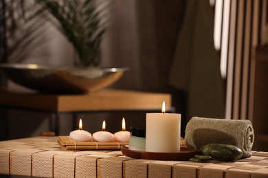 Beautiful composition with different spa products on wicker bench indoors