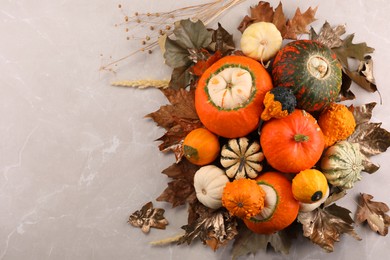 Photo of Flat lay composition with ripe pumpkins on light grey table. Space for text