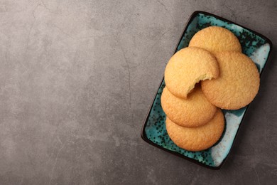Delicious Danish butter cookies on grey table, top view. Space for text