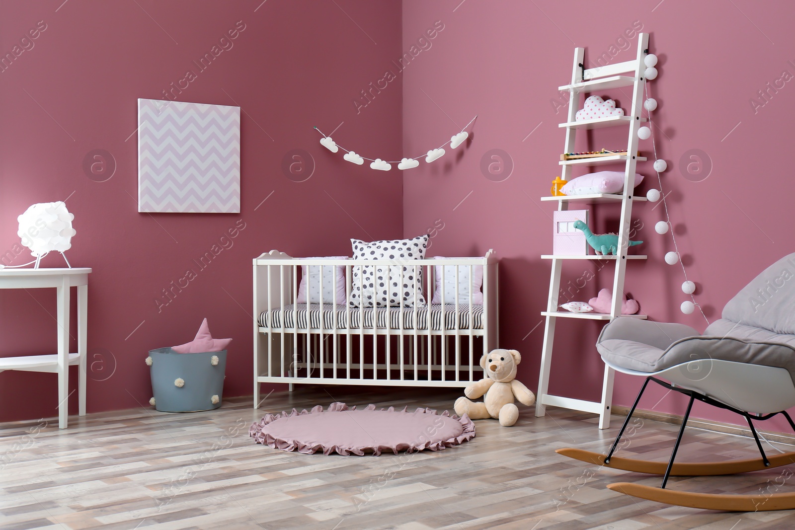 Photo of Stylish baby room interior with crib