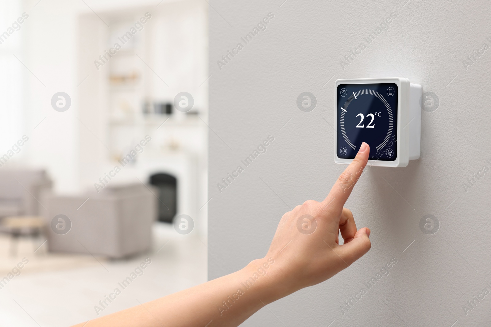 Image of Smart home system. Woman using thermostat indoors, closeup