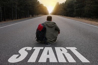 Image of Man sitting on road with word Start near forest, back view