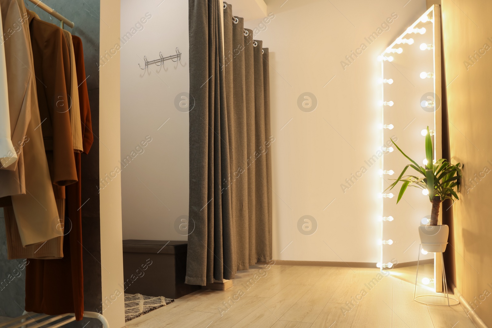 Photo of Dressing rooms in fashion store. Interior design